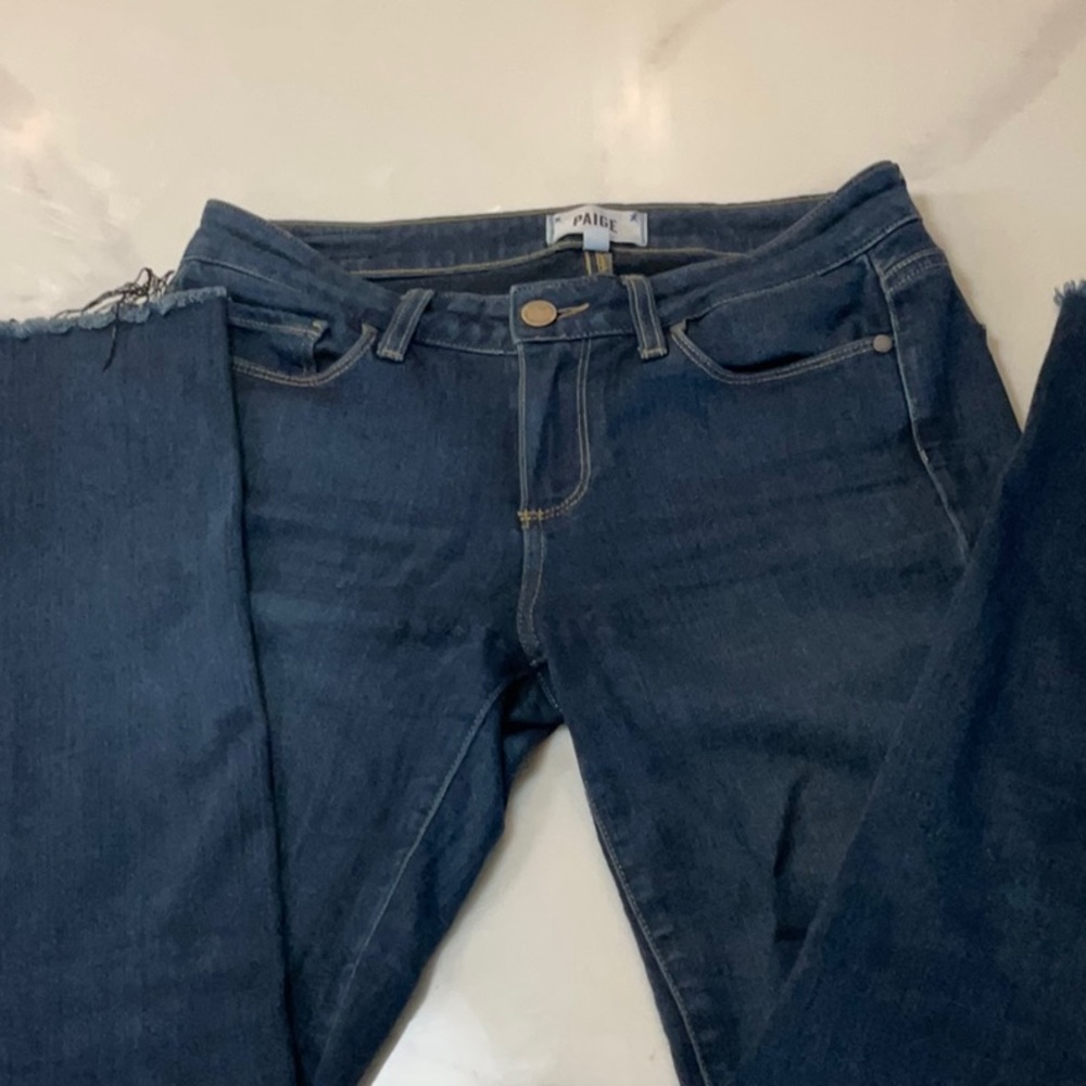 - Paige Skyline skinny blue jeans. Stretch material with frayed bottoms.